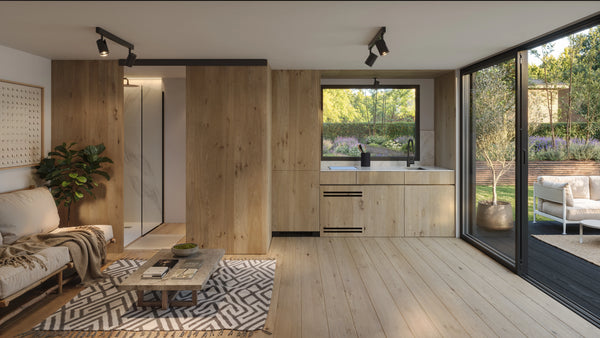 Prefab pool house kitchenette — worktop, sink and undercounter fridge along one wall